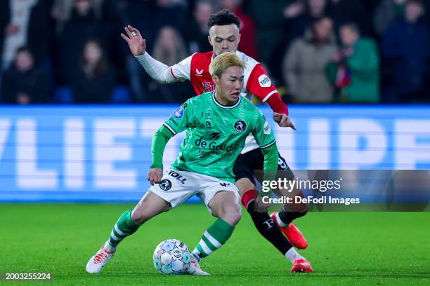 Shunsuke Mito of Sparta Rotterdam and Quillindschy Hartman of Feyenoord Rotterdam battle for the ball during the Dutch Eredivisie match between...