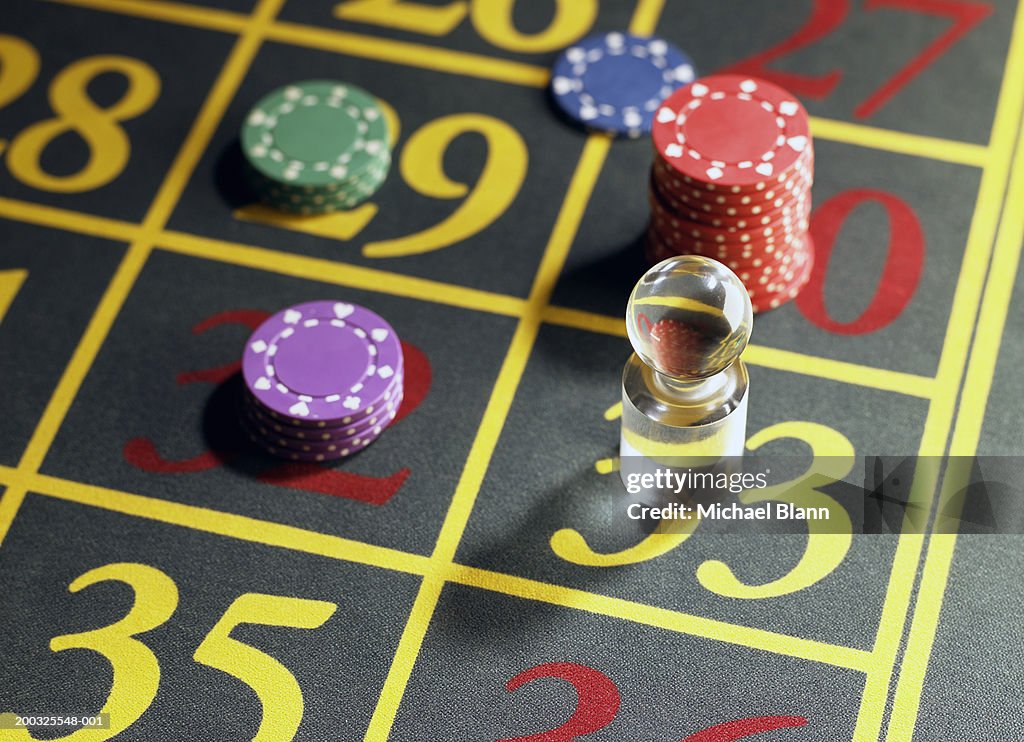 Win marker and gambling chips on roulette table