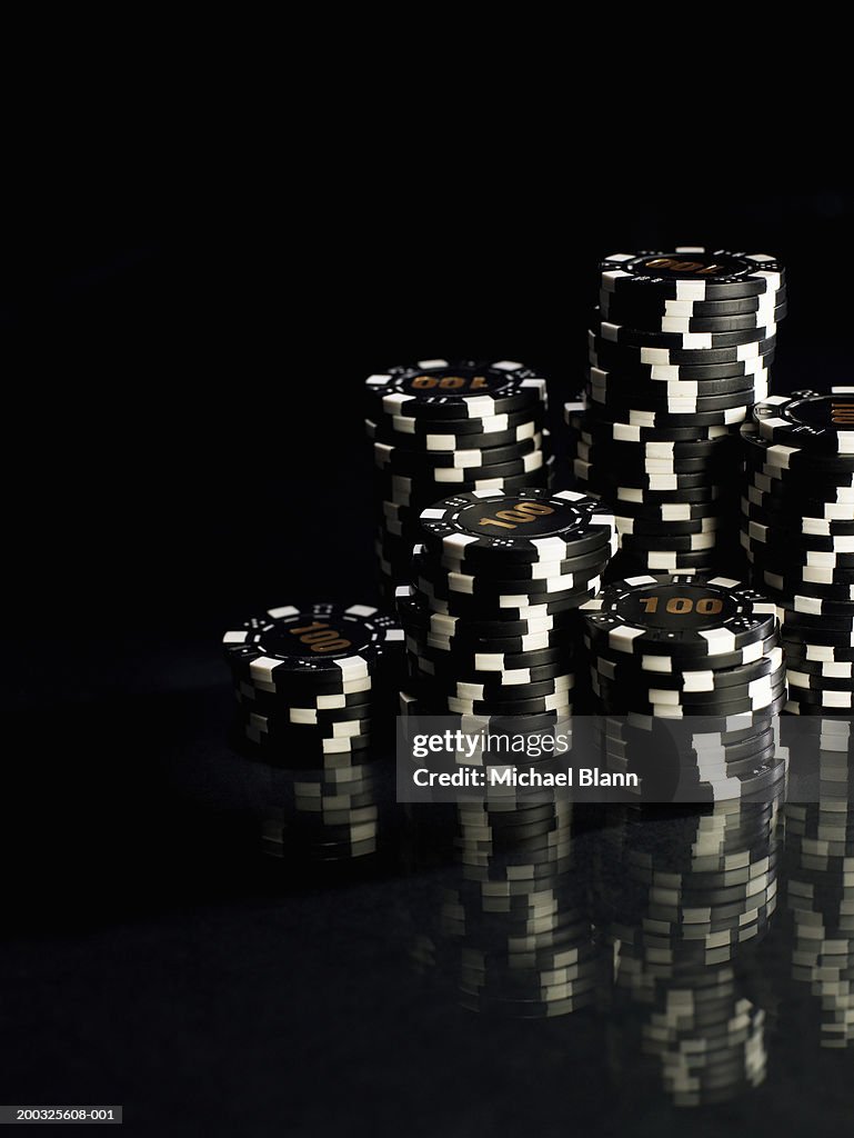 Stacks of black and white gambling chips, close-up