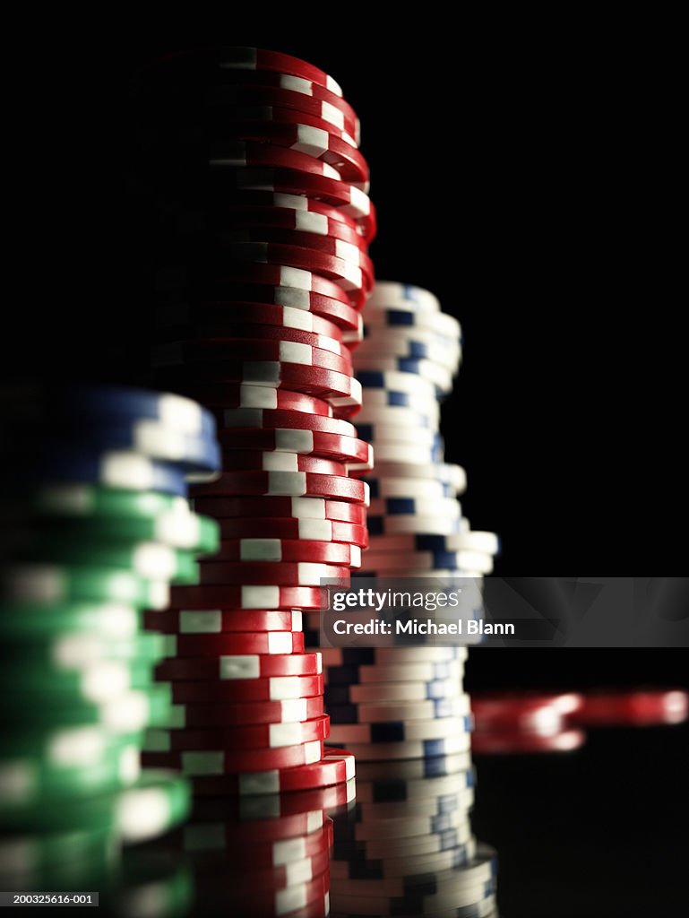 Stacks of gambling chips, close-up (focus on red chips)