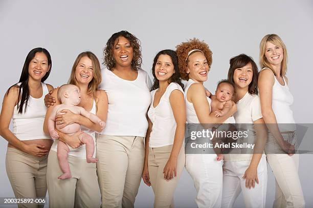 group of multi-generational family, smiling, portrait - pregnant redhead ストックフォトと画像
