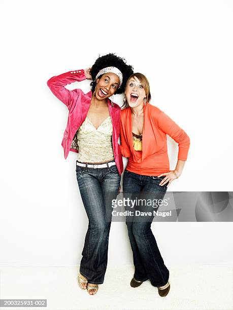 two young woman laughing, portrait - two people white background stock pictures, royalty-free photos & images