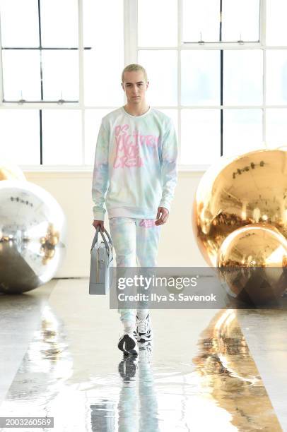 Model walks the runway wearing OS VMC with Suave Suede bags during Flying Solo NYFW February 2024 at Canoe Studios on February 11, 2024 in New York...