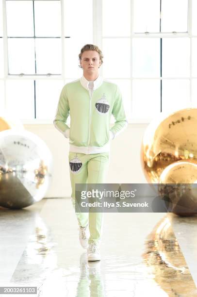 Model walks the runway wearing OS VMC with Suave Suede bags during Flying Solo NYFW February 2024 at Canoe Studios on February 11, 2024 in New York...