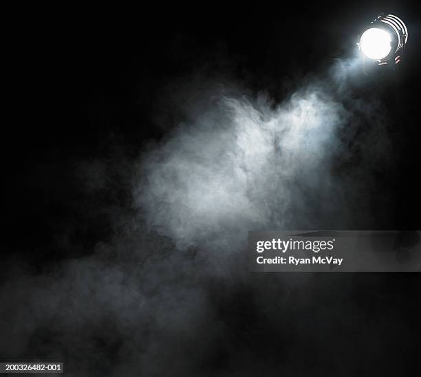 smoke beneath spotlight - spot lights stock-fotos und bilder