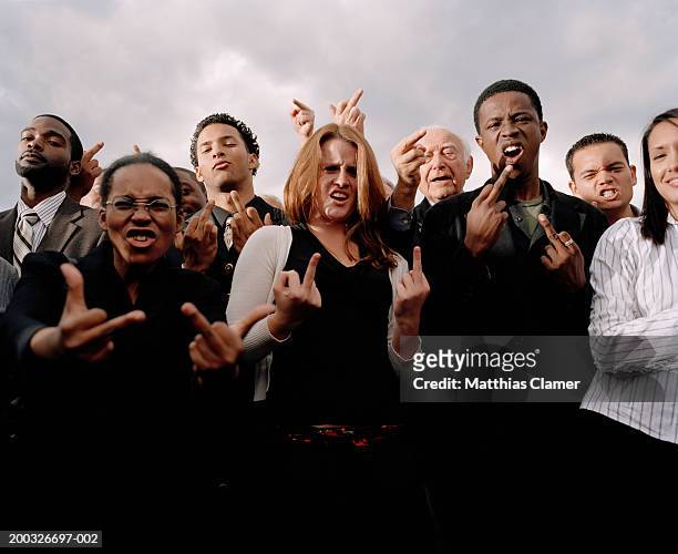 businesspeople making obscene gestures - v sign stock pictures, royalty-free photos & images