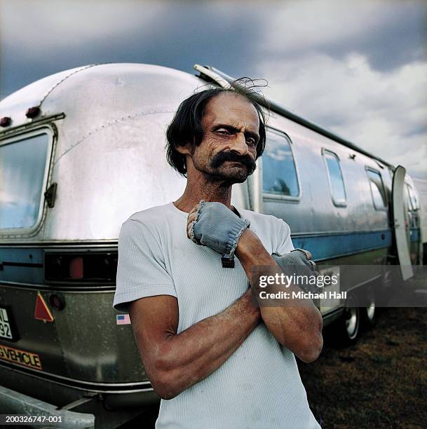 man standing by van with arms crossed, portrait - handlebar moustache stock pictures, royalty-free photos & images