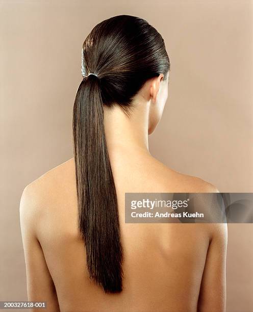 woman with hair in ponytail, rear view - pferdeschwanz stock-fotos und bilder