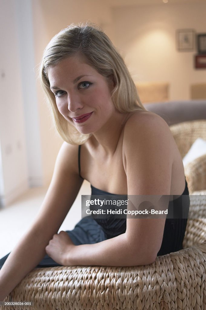 Young woman in chair, portrait