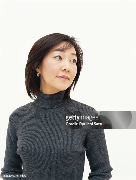 mid adult woman looking away - sideways glance stock pictures, royalty-free photos & images