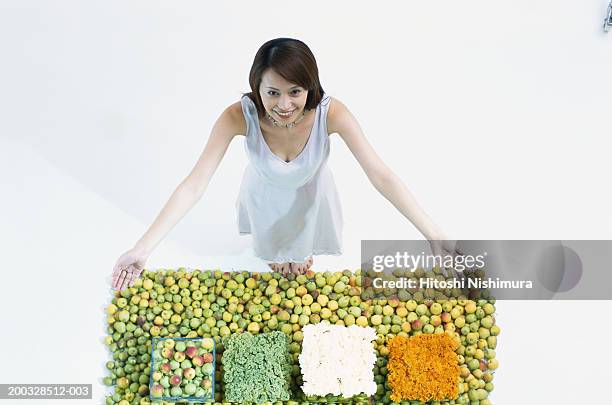 young woman with fruits, looking up, elevated view - japanese bussiness woman looking up imagens e fotografias de stock