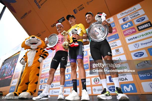 Richard Carapaz of Ecuador and Team EF Education - EasyPost on second place, race winner Rodrigo Contreras of Colombia and Team Nu Colombia - Yellow...