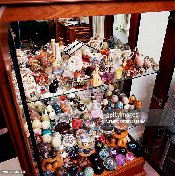 ornamental collection in display cabinet, close up, elevated view - obsession photos et images de collection