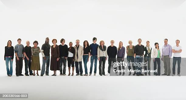 row of people standing in line, smiling, portrait - large group of people white background stock pictures, royalty-free photos & images