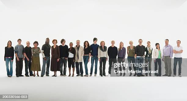row of people standing in line, smiling, portrait - stand in a row stock pictures, royalty-free photos & images