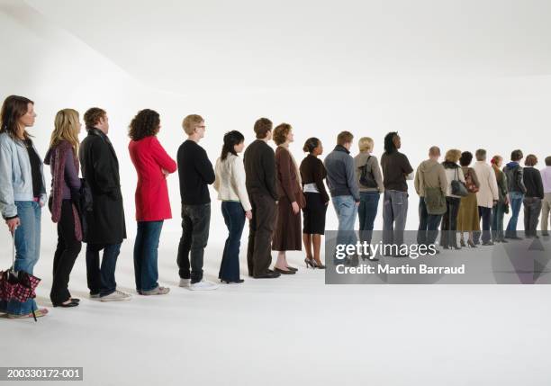 row of people standing in line, rear view (digital enhancement) - woman waiting in line stock pictures, royalty-free photos & images