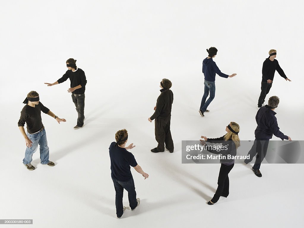 Group of people wearing blindfolds