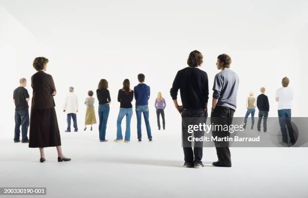 group of people standing in studio, rear view - back view person photos et images de collection