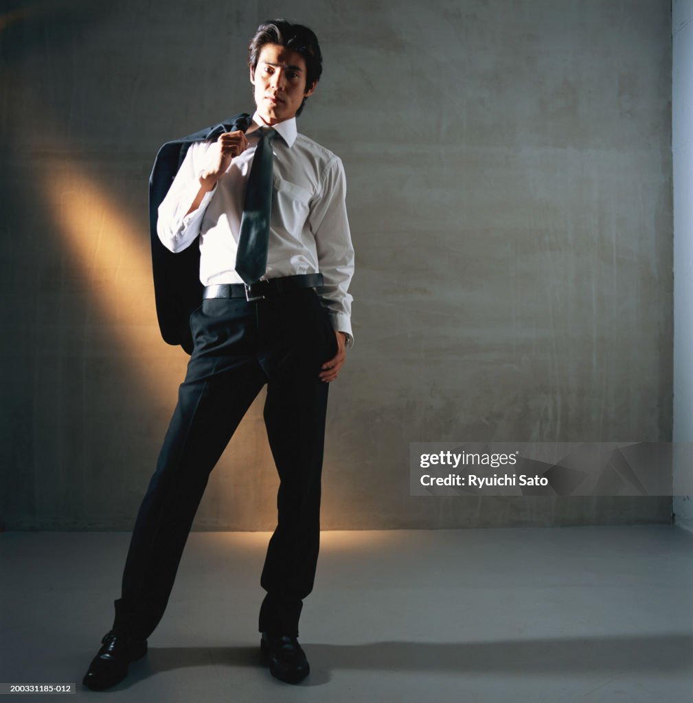 Businessman standing, portrait