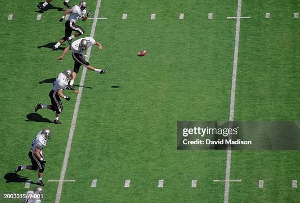 football team kicking off, elevated view - kick off fotografías e imágenes de stock