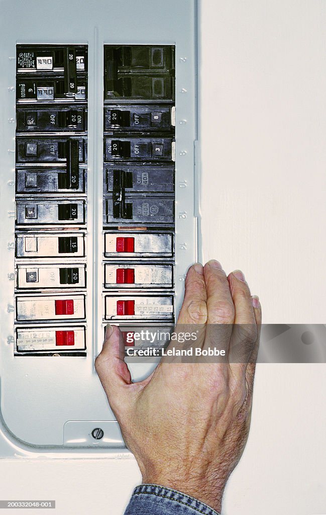 Getting A Switch Beating Man Flipping Switch On Circuit Breaker Closeup High-Res Stock Photo ...