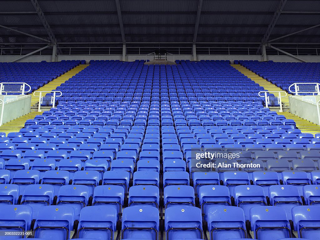 Rows of blue seats in stadium