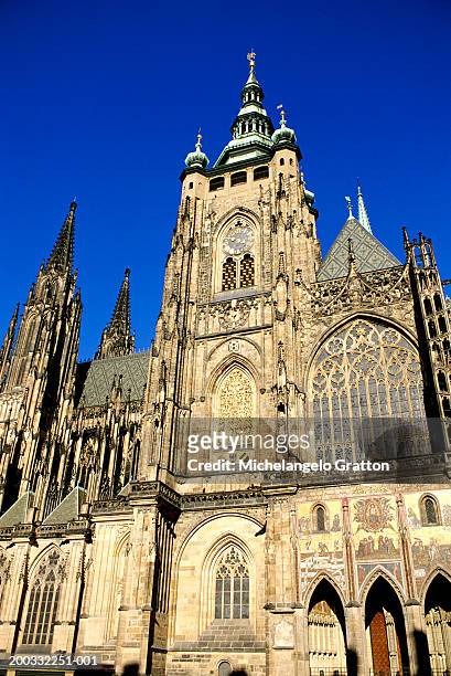 czech republic, prague, st vitus's cathedral clock tower, low angle - czech republic stock pictures, royalty-free photos & images