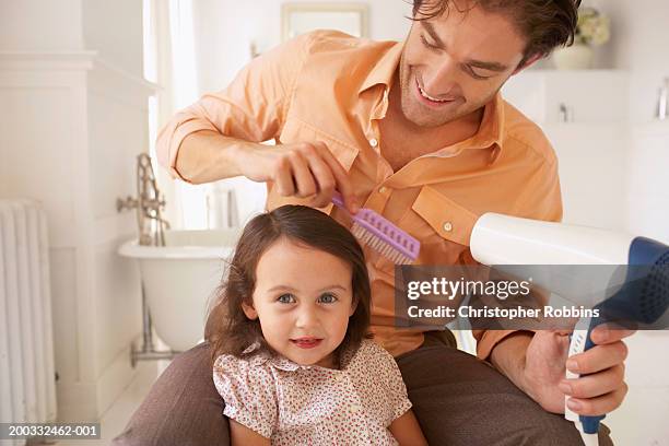 father blowdrying daughter's (2-4) hair, close-up - girl short hair stock pictures, royalty-free photos & images