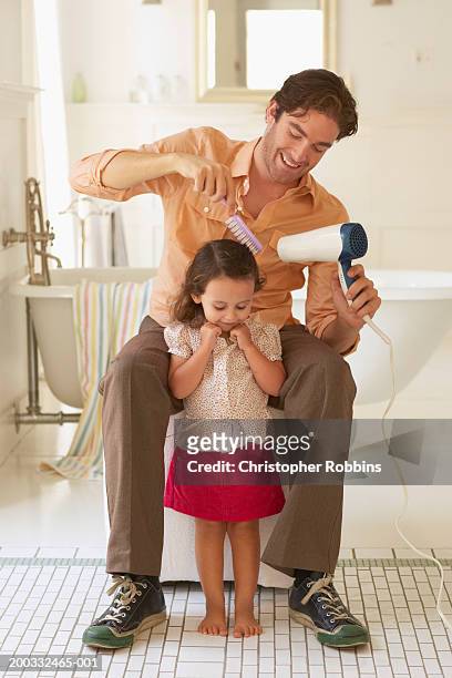 father blowdrying daughter's (2-4) hair in bathroom - girl short hair stock pictures, royalty-free photos & images