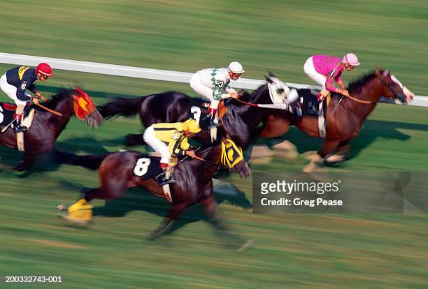thoroughbred horse race on turf (digital enhancement, blurred motion) - jockey fotografías e imágenes de stock