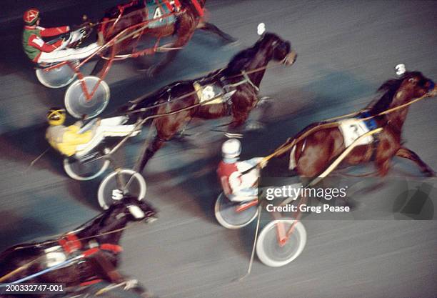 harness race, elevated view (blurred motion) - equestrian event stock pictures, royalty-free photos & images