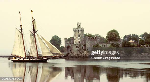 ireland, schooner sailing past black rock castle in morning mist - river lee cork stock pictures, royalty-free photos & images