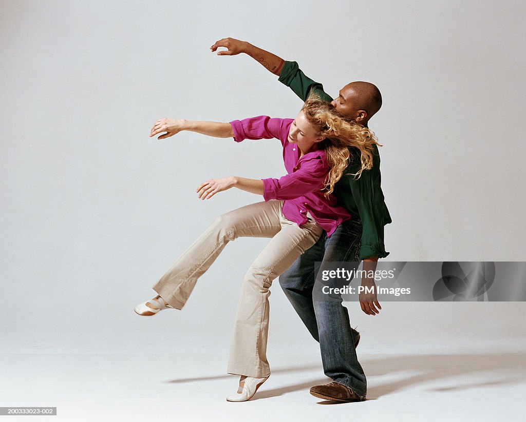 Young Man And Woman Falling Backwards Side View High-Res Stock Photo ...
