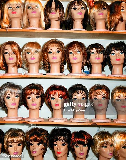 rows of female mannequin heads on shelves - toupee stock pictures, royalty-free photos & images