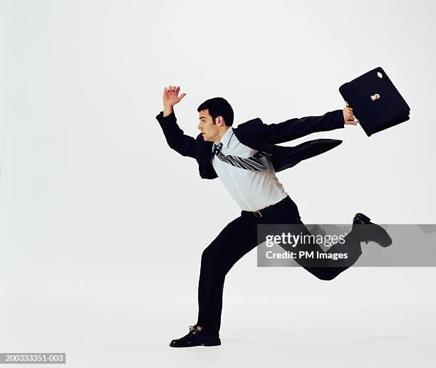 businessman running with briefcase, side view - necktie run stockfoto's en -beelden