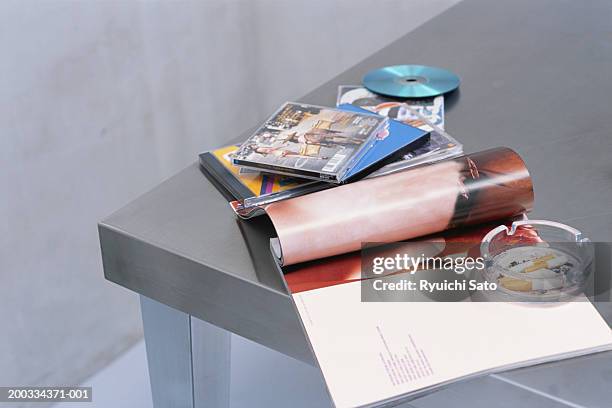 ashtray, cd's and magazines on table, elevated view - magazines on table bildbanksfoton och bilder