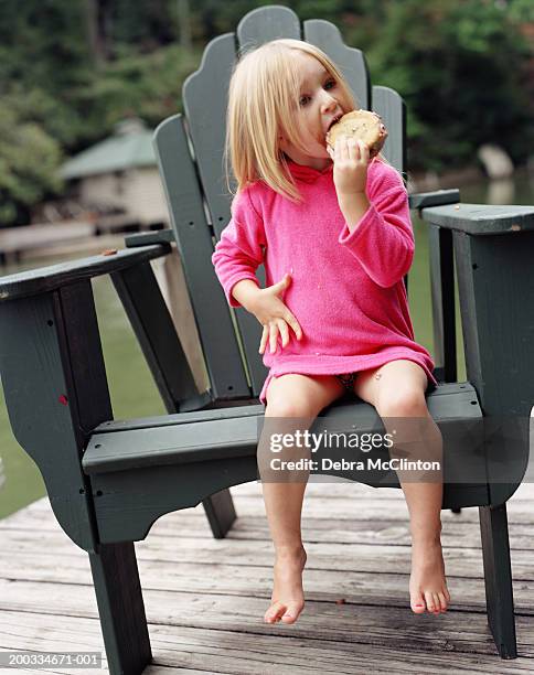girl (3-5) eating ice cream sandwich - eating ice cream sandwich stock pictures, royalty-free photos & images