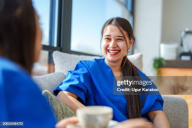 healthcare workers interacting each other with mobile phones - day in the life series stock pictures, royalty-free photos & images