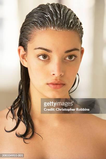 young woman with conditioner in hair, close-up - hair conditioner stockfoto's en -beelden