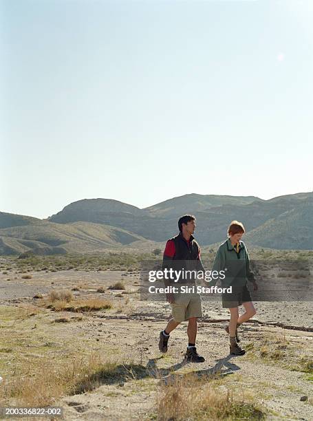 young couple walking in desert - red rock canyon state park california bildbanksfoton och bilder