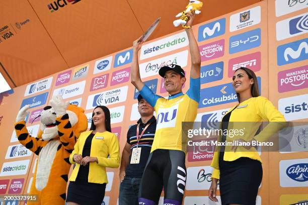 Rodrigo Contreras of Colombia and Team Nu Colombia - Yellow Leader Jersey celebrates at podium as Best Colombian Rider Jersey winner during the 4th...