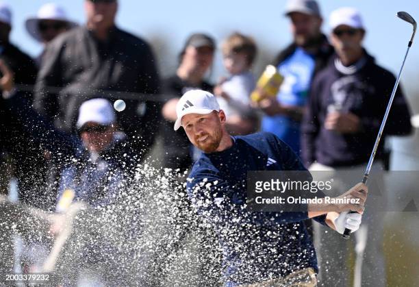 Daniel Berger of the United States plays a shot from a bunker on the fourth hole during the final round of the WM Phoenix Open at TPC Scottsdale on...