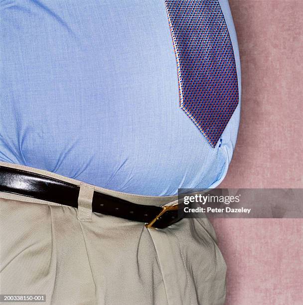 mature businessman's stomach, mid section, close-up - pens stockfoto's en -beelden