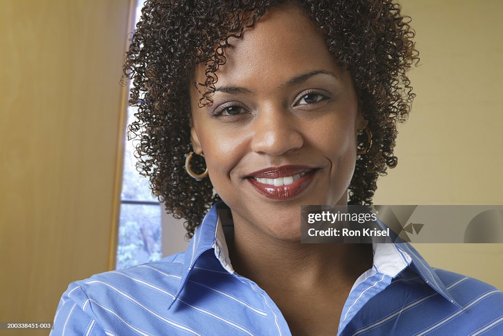 Businesswoman smiling, close-up