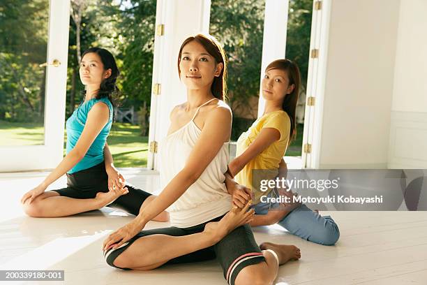 three young women in sage pose - legs spread woman stock pictures, royalty-free photos & images