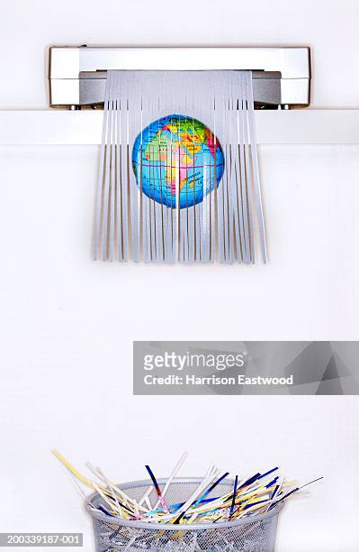 picture of globe in paper shredder above bin - paper shredder on white stock pictures, royalty-free photos & images