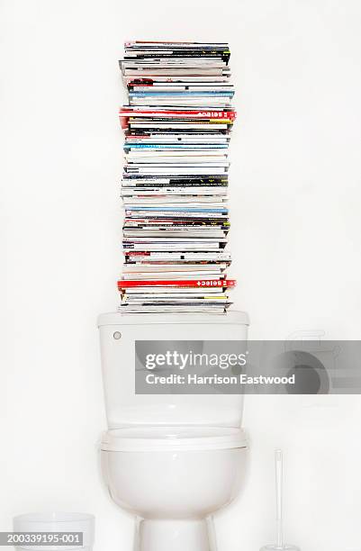 pile of magazines on toilet - magazine stack stock pictures, royalty-free photos & images