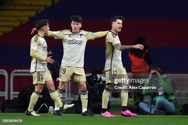 Ricard Sanchez of Granada CF celebrates scoring his team's first goal with teammates Facundo Pellistri and Oscar Melendo during the LaLiga EA Sports...