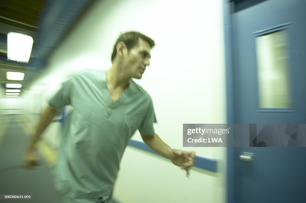 Doctor running into examination room (blurred motion)