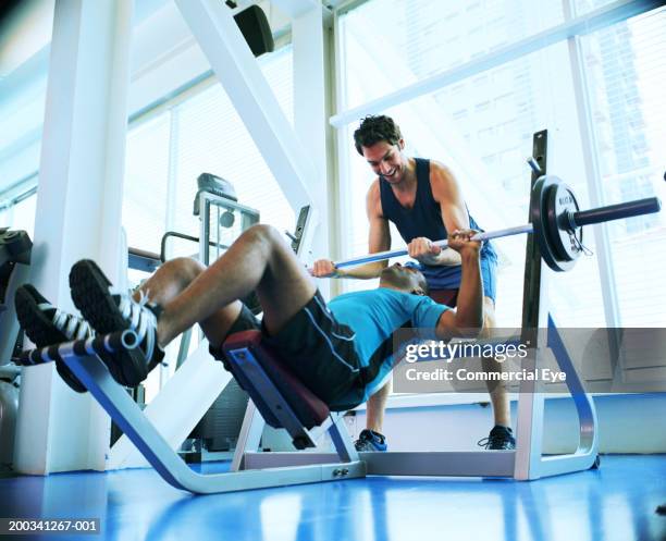 two men weight training in gym, low angle view - workout bench stock pictures, royalty-free photos & images